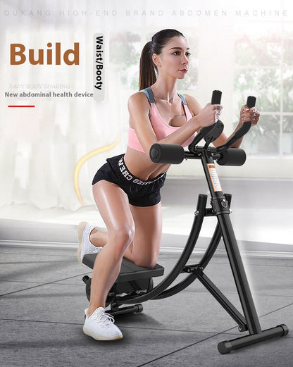A woman kneels on a black abdominal exercise machine with handlebars, wearing a pink sports bra, black shorts, and white sneakers in a bright indoor gym setting. Text on the left reads 'Build Waist/Booty' and 'New abdominal health device.
